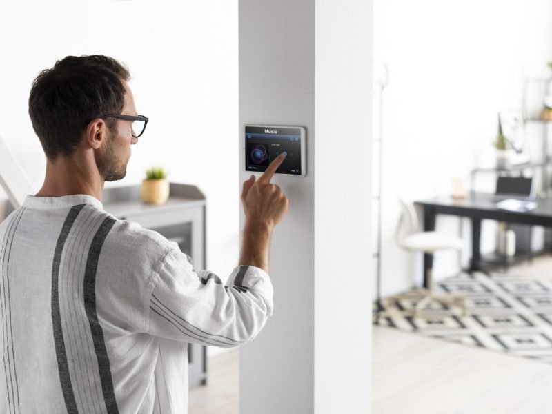 man-using-tablet-his-smart-home